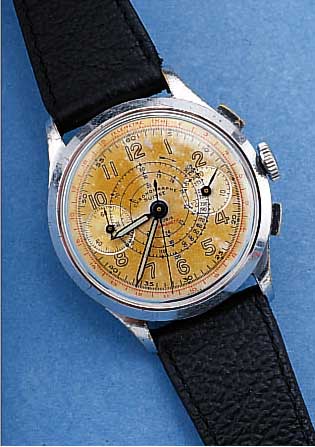 BENEDICT WATCH ARMBANDCHRONOGRAPH, SCHWEIZ UM 1947, MET. VERCHR., EDELST.-BOD. U. GLASR. AUFGEDR., BLATT ALTERBED. FARBL. GETöNT, 30 MIN. ...