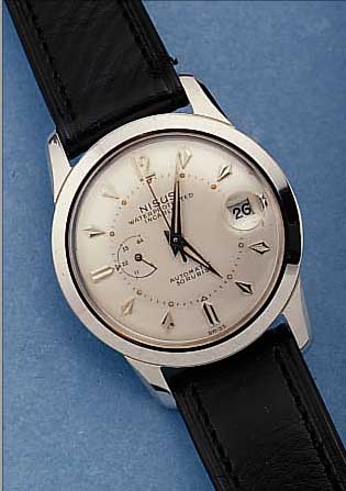 NISUS HERRENARMBANDUHR GANGRESERVE/AUTOMATIK, REF.-NR.3899 P, EDELSTAHL, SCHWEIZ UM 1958, BODEN GESCHR., GANGRESERVE ANZEIGE B. 9, 44 STD., 30 ...