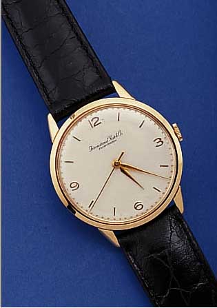 IWC HERRENARMBANDUHR, SCHWEIZ UM 1963, NEU- TR. ROSE-G. 750/000-GEH., BODEN U. GLASR. GE- DR., BLATT REST., RUNDANKERW., KAL. 89, HAND- AUFZUG, ...