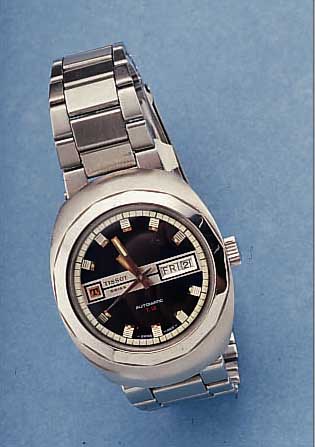TISSOT HERRENARMBANDUHR AUTOMATIK, REF.-NR. T12, SCHWEIZ UM 1972, EDELST., EDELST.-BAND, BODEN U. GLASR. GESCHR., BOMB. MINERALGL., BEI ...