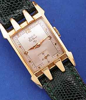 ELGIN HERRENARMBANDUHR DELUXE, USA UM 1950, GG-FILLED, AUFWEND. RECT.-FORM, BODEN GEDR., VERS. BLATT, FORMANKERW., 17 ST., KAL. 672, SCHR.-UNR., ...