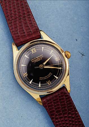 LACO HERRENARMBANDUHR VW 100.000, REF.-NR. 62679, DEUTSCHL. UM 1958, METALL HART VERG., BER., EDELSTAHL SCHRAUBBODEN, LEDERBAND NEU, 21 ST., ...