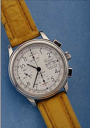 COMOR ARMBANDCHRONOGRAPH GRAND PRIX, REF.- NR. 051/229, SCHWEIZ UM 1996, EDELST., TEILW. POL., BOMB. MINERALGL., BODEN GEDR., AUF BODENLIM. AUFL. ...