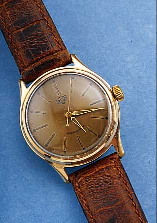GUB HERRENARMBANDUHR, DEUTSCHLAND UM 1962, METALL VERG., BER., EDELST.-BODEN GESCHR., RUNDANKERW., HANDAUFZUGKAL. 60,1, RINGUNR., FLACHSPIR., ...