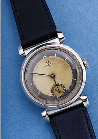 OMEGA HERRENARMBANDUHR ART DECO, REF.-NR. 9102808, SCHWEIZ UM 1938, EDELST., ORIG.- BLATT FL., 15 ST., HANDAUFZUGKAL. 26,5, SCHR.-UNR., ...