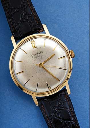 GLASHÜTTE HERRENARMBANDUHR, DEUTSCHLAND UM 1966, METALL GELBVERG., EDELST.-BODEN GEDR., BLATT L. FL., 17 ST., HANDAUFZUGKAL. 70,1, RINGUNR., ...