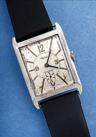 WYLER HERRENARMBANDUHR, REF.-NR. 1108529, SCHWEIZ UM 1935, 875ER SILBER, GR. RECT.-FORM,M. SCHARNIERBODEN, MAßE CA. 41 X 27 MM, VERS. ORIG.-BLATT ...