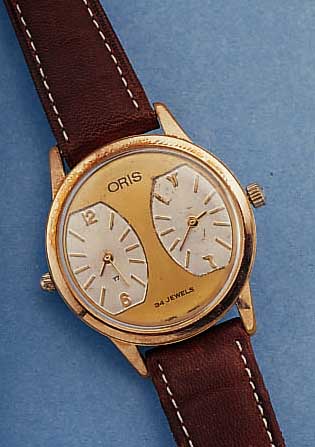 ORIS 2-ZEITZONENUHR, SCHWEIZ UM 1965, METALL ROTVERG., BER., EDELST.-BODEN GESCHR., BLATT TEILW. REST., EINGES., 2 VONEINANDER UNABH. ...