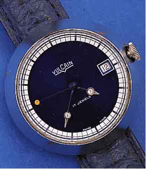 VULCAIN ARMBANDUHR MYSTERIEUSE, SCHWEIZ UM 1976, METALL MASSIV HARTVERCHR., BER., EDELST.-BODEN GEDR., MINUTEN U. STD.-ZEIGER M. ...