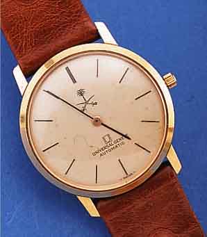 UNIVERSAL GENEVE HERRENARMBANDUHR AUTOMATIK, REF.-NR. 266111, SCHWEIZ UM 1965, GG 750/000,BODEN U. GLASR. GEDR., VERS. BLATT M. SONDER- AUFDR., ...
