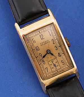 CONSUL HERRENARMBANDUHR, SCHWEIZ UM 1940, GG 585/000, RECT.-FORM, SCHARNIERB., BLATT FL., FORMANKERW., KAL. 72, 15 ST., SCHR.-UNR.,FLACHSPIR., ...