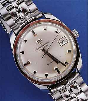 JULES JÜRGENSEN HERRENARMBANDUHR AUTOMATIK, SCHWEIZ UM 1964, EDELST., BODEN GESCHR., NEU- TR. EDELST.-BAND, WERK VERG., ZENTRALROTOR, 17 ST., ...