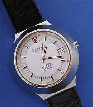 OMEGA HERRENARMBANDUHR CONSTELLATION ELEKTRO- NIK CHRONOMETER, REF.-NR. 1980013, SCHWEIZ UM 1973, EDELST.-GEH. MASSIV, IN EINANDER 2-FACH ...