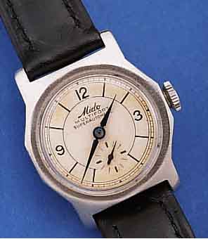 MIDO HERRENARMBANDUHR MULTIFORT HAMMERAUTOMA- TIK, REF.-NR. 406212, SCHWEIZ UM 1942, EDELST., BODEN GESCHR., ORIG.-BLATT ALTERSBE- D. FARBL. ...