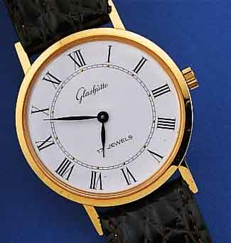 GLASHÜTTE HERRENARMBANDUHR, DEUTSCHLAND UM 1984, METALL HARTVERG., EDELST.-BODEN GEDR., EMAILFARB. KONTRASTZIFFERBL., LEDERB., DAMEN- ...