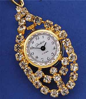 KONVOLUT: 2 GLASHÜTTE ANHäNGEUHREN, METALL M. STRAßBES. (1X GELB, 1X WEIß VERG.), UNGETR.LAGERW., EHEM. DDR PRODUKT. UM 1986, ALLE ...
