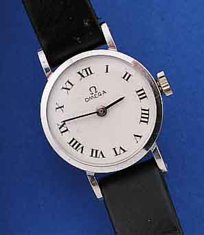OMEGA DAMENARMBANDUHR, SCHWEIZ/USA UM 1969, WG 585/000 ROD., ORIG.-LEDERB., BODEN GEDR., VERS. KONTRASTZIFFERBL., RUNDANKERW., HANDAUF-ZUGKAL. 620, ...