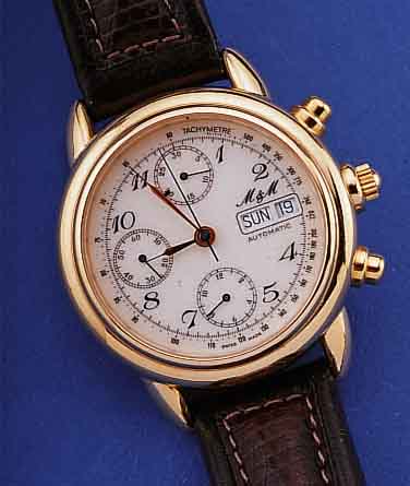 M & M ARMBANDCHRONOGRAPH AUTOMATIK, REF.- NR. 4973, SCHWEIZ UM 1997, METALL HARTVERG., BEIDS. MINERALFLACHVERGL., EMAILFARB. BLATT, 30-MIN.- U. ...