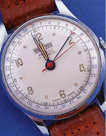 PIERCE WATCH CO/ASU HERRENARMBANDUHR, SCHWEIZ UM 1948, METALL VERCHR., EDELST.-BODENU. GLASR. GEDR., VOLLKALENDER AUßER ...