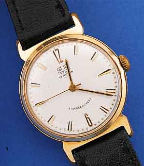 GUB HERRENARMBANDUHR, REF.-NR. 9501, DEUTSCHLAND UM 1961, METALL ROTVERG., BER., EDELST.-BODEN GEDR., ZIFFERBL. LT. EINL. ERN.,17 ST., ...