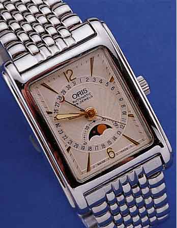 ORIS HERRENARMBANDUHR AUTOMATIK VOLLKALENDER, REF.-NR. B7460, SCHWEIZ UM 1995, EDELST. POL., BODEN 4-FACH VERSCHR., RECT.-FORM, BOMB. ...
