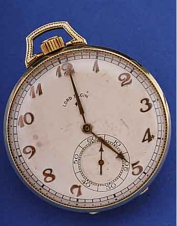 LORD ELGIN HERRENTASCHENUHR, USA UM 1925, GG 585/000, VERS. BLATT, ALTERSBED. FL., ORIG.-STIL-FORM-ZEIGER, CLASSIC MODELL GEFERT.NACH PATENT ...