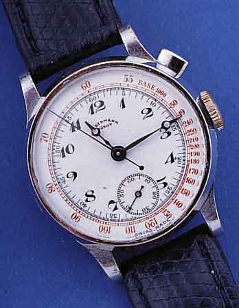 WIEDEMANN ARMBANDCHRONOGRAPH, SCHWEIZ UM 1930, METALL VERCHR., EDELST.-BODEN U. GLASR. GEDR., PERF. EMAILBL. M. TACHYMETERAUßENSKALA,OHNE ...
