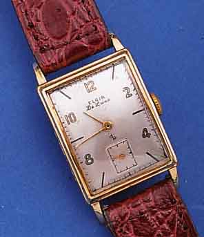 ELGIN HERRENARMBANDUHR DELUXE, USA UM 1948, GG-FILLED, RECT., BODEN GEDR., FORMANKERW., 17 ST., HANDAUFZUGKAL. 624, SCHR.-UNR., BREG.-SPIR., ...