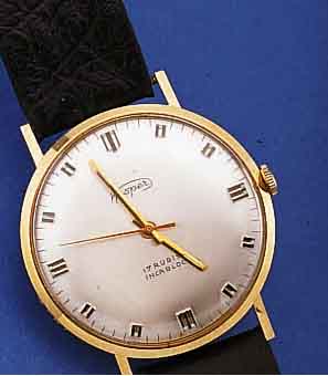 KASPER HERRENARMBANDUHR, DEUTSCHLAND UM 1962, GG 585/000, BODEN GEDR., LEDERB. SEK., RUNDANKERW., 17 ST., HANDAUFZUGKAL. 1400, RINGUNR., ...