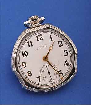 ILLINOIS/CRITERION HERRENTASCHENUHR, USA UM 1925, WG-FILLED, AUFWEND. FORM, BLATT REST., 17 ST., BRüCKENANKERW., VERSCHR. CHATONS, RG-RäDER, ...