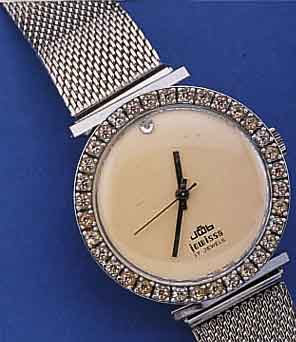JOWISSA HERRENSCHMUCKUHR, SCHWEIZ UM 1990, METALL VERCHR., EDELST.-FLECHTB., LüNETTE AUF-WEND. M. SCHMUCKSTEINBES., WIE BEI 12, BODEN GEDR., 17 ...