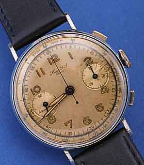 HUGA SA ARMBANDCHRONOGRAPH, SCHWEIZ UM 1940, METALL VERCHR., EDELST.-BODEN U. GLASR. GEDR., VERS. ORIG.-BLATT, ALTERSBED. FL., ...