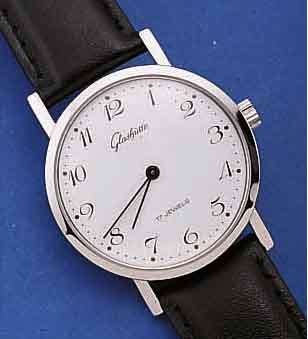 GLASHÜTTE HERRENARMBANDUHR, DEUTSCHLAND UM 1982, METALL HARTVERCHR., EDELST.-BODEN GEDR.,BEI FERTIGUNG WASSERGESCH., EMAILFARB. KON- ...
