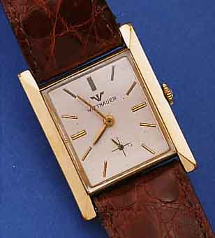WITNAUER HERRENARMBANDUHR, SCHWEIZ/USA UM 1952, GG-FILLED, CARREE-FORM, BODEN GEDR., KONKAVGL., ORIG.-BLATT ALTERSBED. L. FL., FORMANKERW., ...