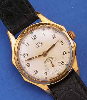GUB HERRENARMBANDUHR, REF.-NR. 42980, DEUTSCHLAND UM 1955, METALL VERG., BER., EDELST.-BODEN GESCHR., NUTZSP. ALTERSBED., KAL. 60, 15 ...