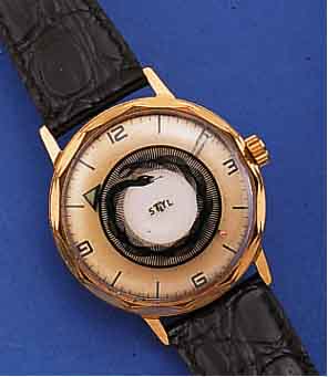 STYL HERRENARMBANDUHR MYSTERIEUSE, UM 1965, METALL M. GG-AUFLAGE, BODEN GESCHR., MYSTER. ZEITANZ. DURCH ZEIGERSCH., SEK.-SCHEIBE M. OPTISCHEM ...