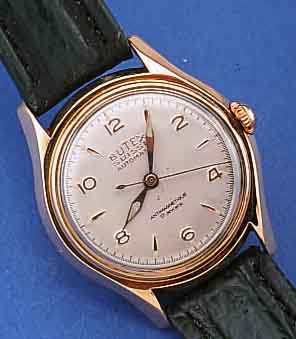 BUTEX HERRENARMBANDUHR AUTOMATIK, REF.-NR. 710, SCHWEIZ UM 1954, RG 750/000, BODEN GE- SCHR., BLATT U. ZEIGER REST., 17 ST., ZENTAL- ROTOR, ...
