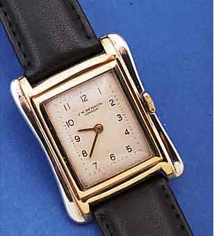 J. W. BENSON HERRENARMBANDUHR, SCHWEIZ/ ENGLAND UM 1935, RG 375/000-GEH., SEITL. TAILL. IN WG, BODEN GEDR., BLATT REST., RUNDANKERW., ...