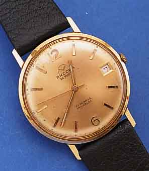 ANCORA HERRENARMBANDUHR, SCHWEIZ UM 1965, GG 750/000, FLACHE GESAMTAUSF., GLASR. GEDR., ORIG.-BLATT ZUM RAND ZU FL., FLACHES RUND- ANKERW. VON ...