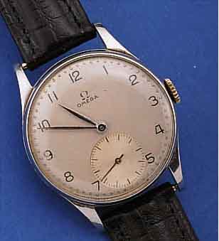 OMEGA HERRENARMBANDUHR, SCHWEIZ UM 1950, EDELST., BODEN U. GLASR. GEDR., VERS. ORIG.- BLATT, ORIG.-ZEIGER, 15 ST., HANDAUFZUGKAL. 30T2, ROT ...
