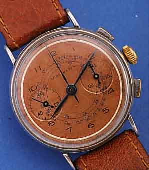 NORD WATCH ARMBANDCHRONOGRAPH, SCHWEIZ UM 1940, METALL VERS., EDELST.-BODEN U. GLASR. GEDR., KUPFERFARB. BLATT, 30-MIN.-STOPPZäHLER,BASISKAL. ...