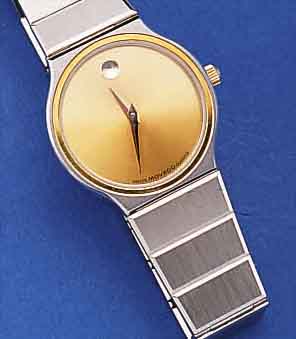 MOVADO DAMENARMBANDUHR MUSEUMS WATCH, EDEL- ST. TEILW. SAT., TEILW. POL., FLACHE AUSF., BODEN 4-FACH VERSCHR., BEI FERTIGST. WASSERGE-SCH., ...
