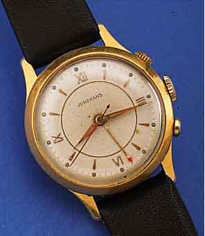 JUNGHANS ARMBANDWECKER, DEUTSCHLAND UM 1956, METALL VERG., BER., EDELST.-BODEN GEDR.,VERS. ORIG.-BLATT, WECKBEREITSCH. AUßEN 4, WECKZEIT ...