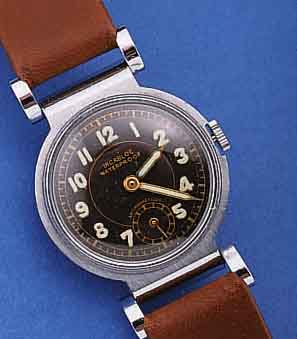 ART DECO ARMBANDUHR, SCHWEIZ UM 1939, METALL HARTVERCHR., BODEN GEDR., BEWEGL. BANDANST., UNGETR. LAGERW., 15 ST., HANDAUF- ZUGKAL. IN ...