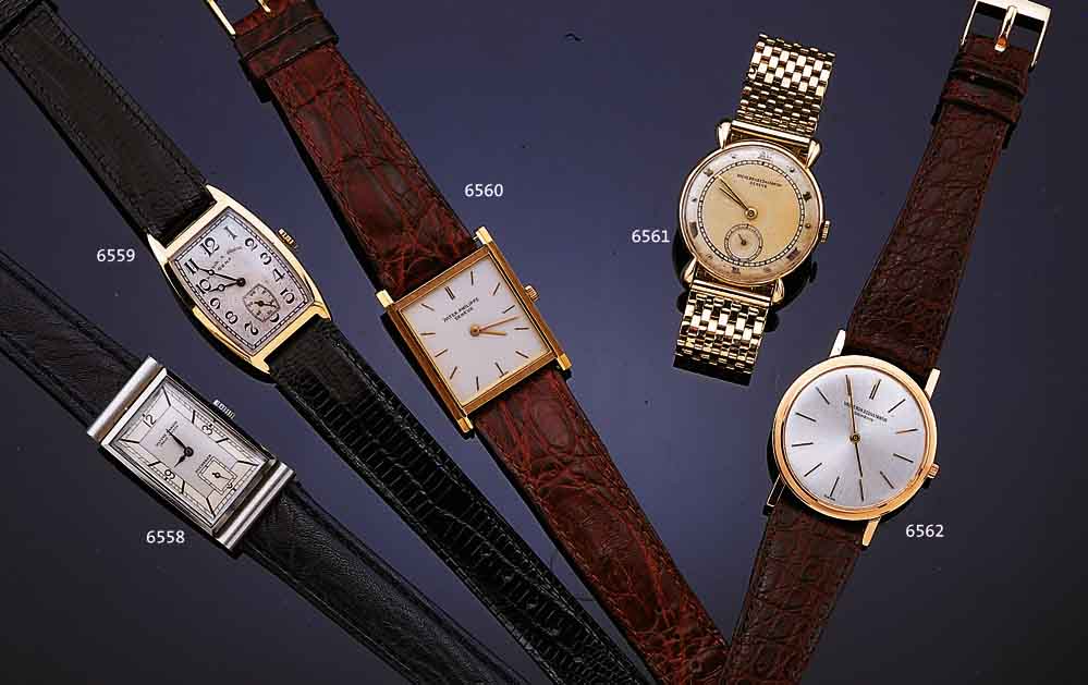 ULYSSE NARDIN/BUCHERER HERRENARMBANDUHR, SCHWEIZ UM 1938, EDELST., RECT.-FORM, VERD. BANDANST., KONKAVGL., BODEN GEDR., IN SICH GEW., BLATT ...
