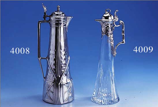 KARAFFE, WMF UM 1900, LEGIERUNG BRITANNIA, KRISTALLKORPUS GESCHNITTEN/GESCHLIFFEN, MON- TIERUNG MIT TYP. WELLENVERZIERUNG, H CA. 27 CM