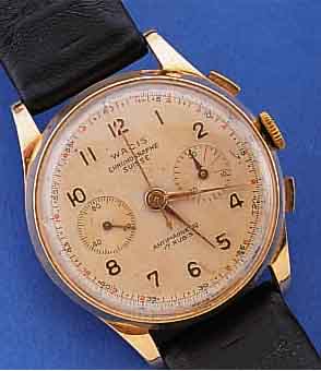 WACIS ARMBANDCHRONOGRAPH SWISSE, SCHWEIZ UM 1955, ROSE-G. 750/000, BODEN U. GLASR. GEDR., METALLCUV. ZUR ARMIERUNG, VERS. BLATT, ALTERS-BED. L. FL., ...