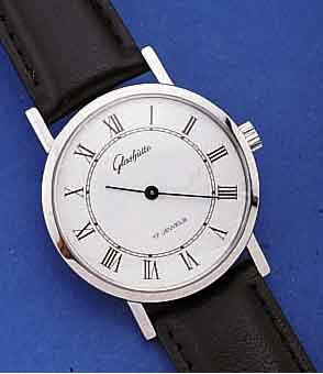 GLASHÜTTE HERRENARMBANDUHR, DEUTSCHLAND UM 1982, METALL HARTCHR., EDELST.-BODEN GEDR., EMAILFARB. KONTRASTZIFFERBL., LEDERB., ORIG.- ETUI, ...