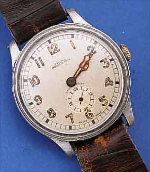 HOMIS WATCH/PRIMA HERRENARMBANDUHR, SCHWEIZ UM 1938, METALL VERN., BODEN U. GLASR. GEDR., ORIG.-ZUSTAND, D. CA. 37 MM, AUF BODEN WID- MUNGSGRAV. ...