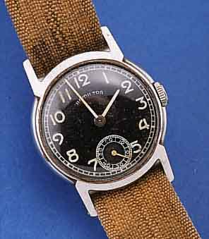 HAMILTON HERRENARMBANDUHR, USA UM 1940, EDELST., BODEN GEDR., KONTRASTZIFFERBL. FL., FORMANKERW., HANDAUFZUGKAL. 980, SCHR.-UNR., BREG.-SPIR., ...